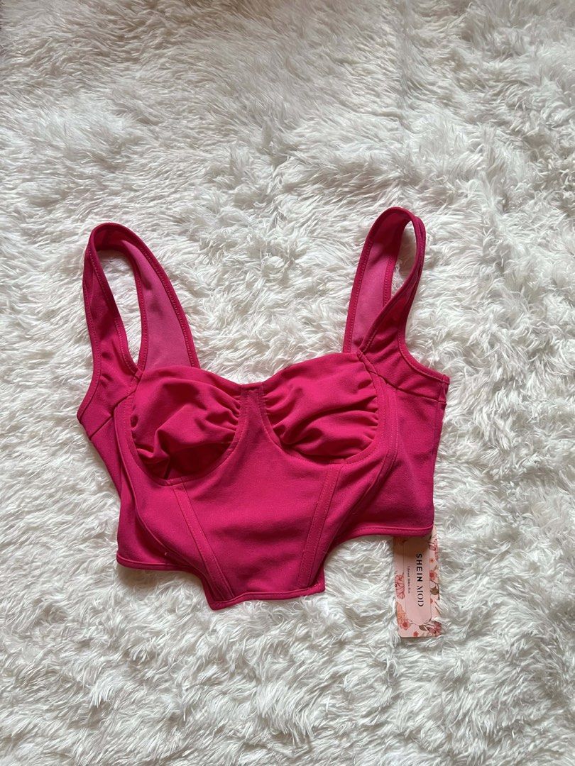 SHEIN MOD Pink Ruched Bust Corset Crop Top (Category: Others Tops) located in Taguig. Submitted by aliyah4537 (Listing ID 1441352160, Image 1). Description: - Cute pink ruched bust crop top - Brand: SHEIN MOD - Corset-style fit with boning details - Strappy design - Perfect for night outs or events - Pairs well with jeans or skirts - Brand new with tag still attached.