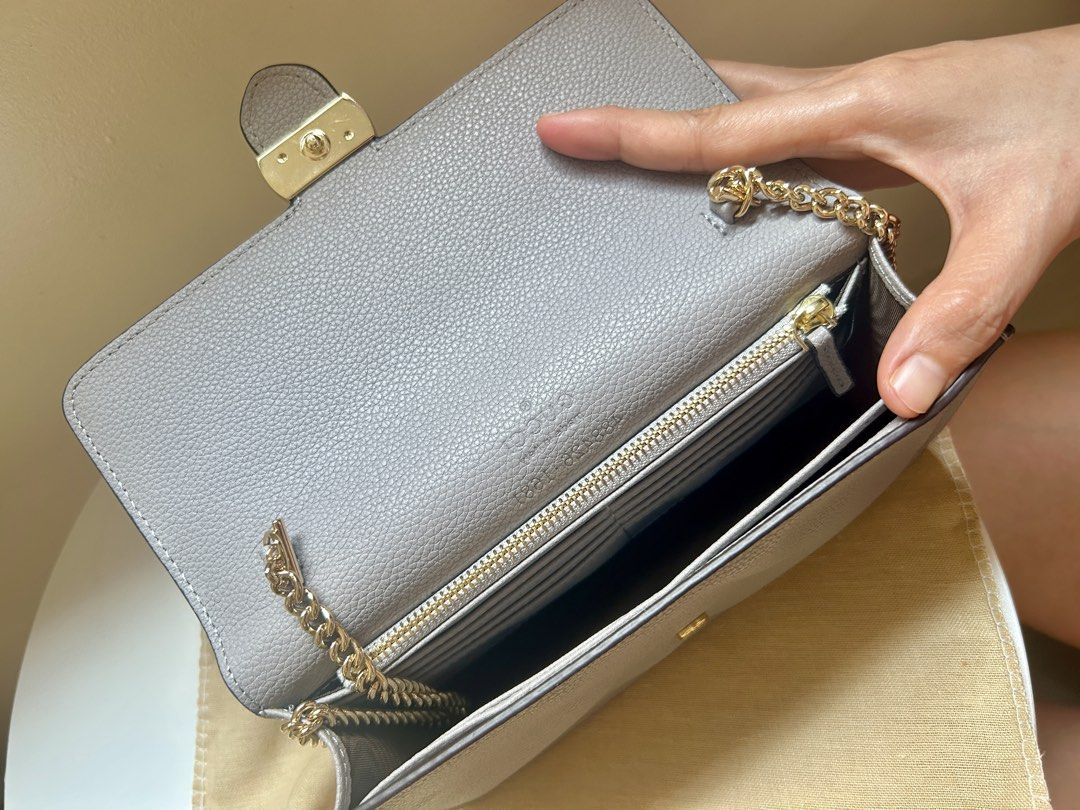 Sling bag (Category: Shoulder Bags) located in Tagbilaran City. Submitted by kashitan_declutter (Listing ID 1441168111, Image 2). Description: Mini sling bag Slight bubbling of skin but no scratches Rfs: no longer in use.