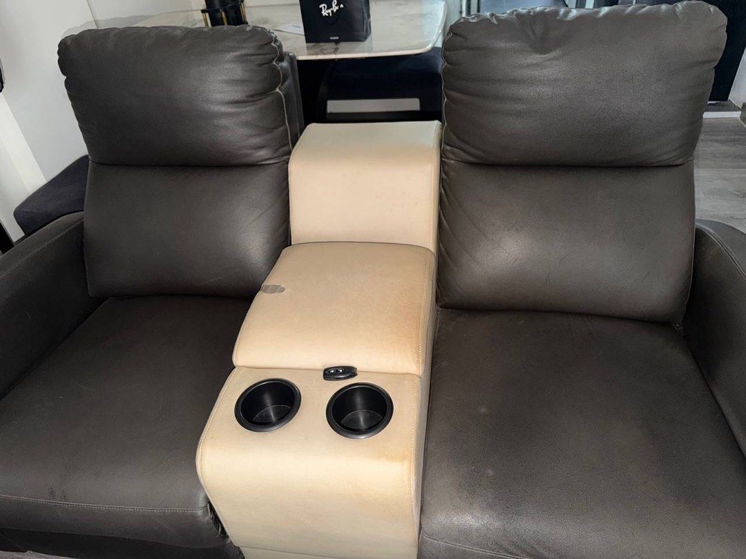 Sofa & Dining Table (Category: Sofas) located in Singapore. Submitted by nxb1l_ (Listing ID 1441292592, Image 2). Description: Two Seater Recliner Sofa With Centre Console Length - 1.65m Width - 1m Height - 90cm Asking 400 able to nego well used quite obv defects on the centre console due to nail glue spillage Two Seater Recliner Sofa Length - 1.3m Width - 1m Height - 90cm Asking 350 able to nego well used quite nothing a good clean can get rid o
