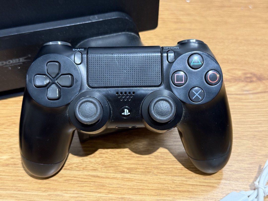 Sony PlayStation 4 Pro Console with Controller and Accessories (Category: PlayStation) located in Manila. Submitted by johneliel.baladjay (Listing ID 1441258724, Image 2). Description: - Sony PlayStation 4 Pro console - One DualShock 4 controller - Power cable - USB charging cable - Vertical stand - Tested and working.