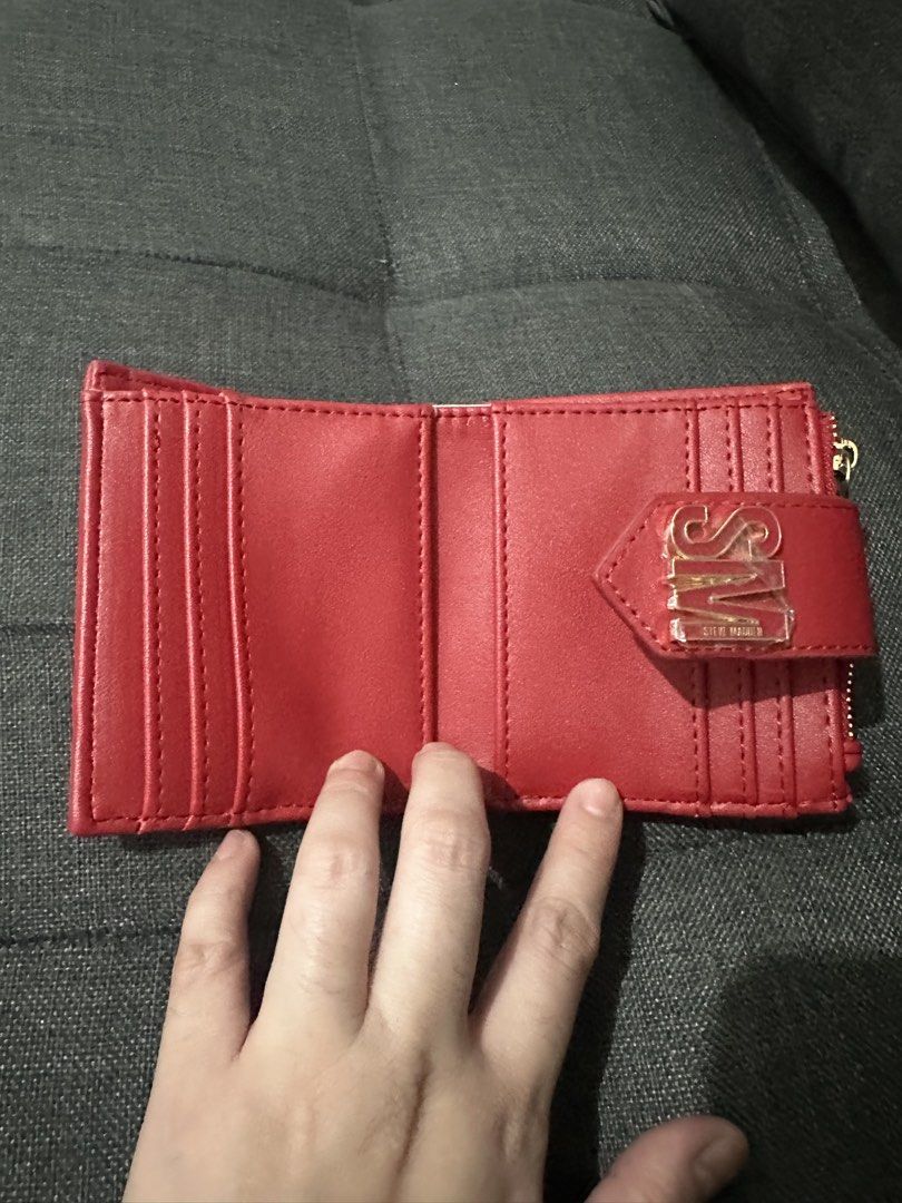 Steve Madden Red Bkai Wallet (Category: Wallets & Card holders) located in Santa Rosa. Submitted by gem1990 (Listing ID 1441350743, Image 3). Description: - Brand new red Steve Madden wallet - Features multiple card slots - Includes a zippered coin pocket - Interior lining with all-over Steve Madden logo print - Comes with original tags attached - Ideal for keeping your essentials organized.