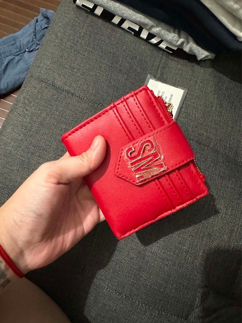 Steve Madden Red Bkai Wallet (Category: Wallets & Card holders) located in Santa Rosa. Submitted by gem1990 (Listing ID 1441350743, Image 1). Description: - Brand new red Steve Madden wallet - Features multiple card slots - Includes a zippered coin pocket - Interior lining with all-over Steve Madden logo print - Comes with original tags attached - Ideal for keeping your essentials organized.