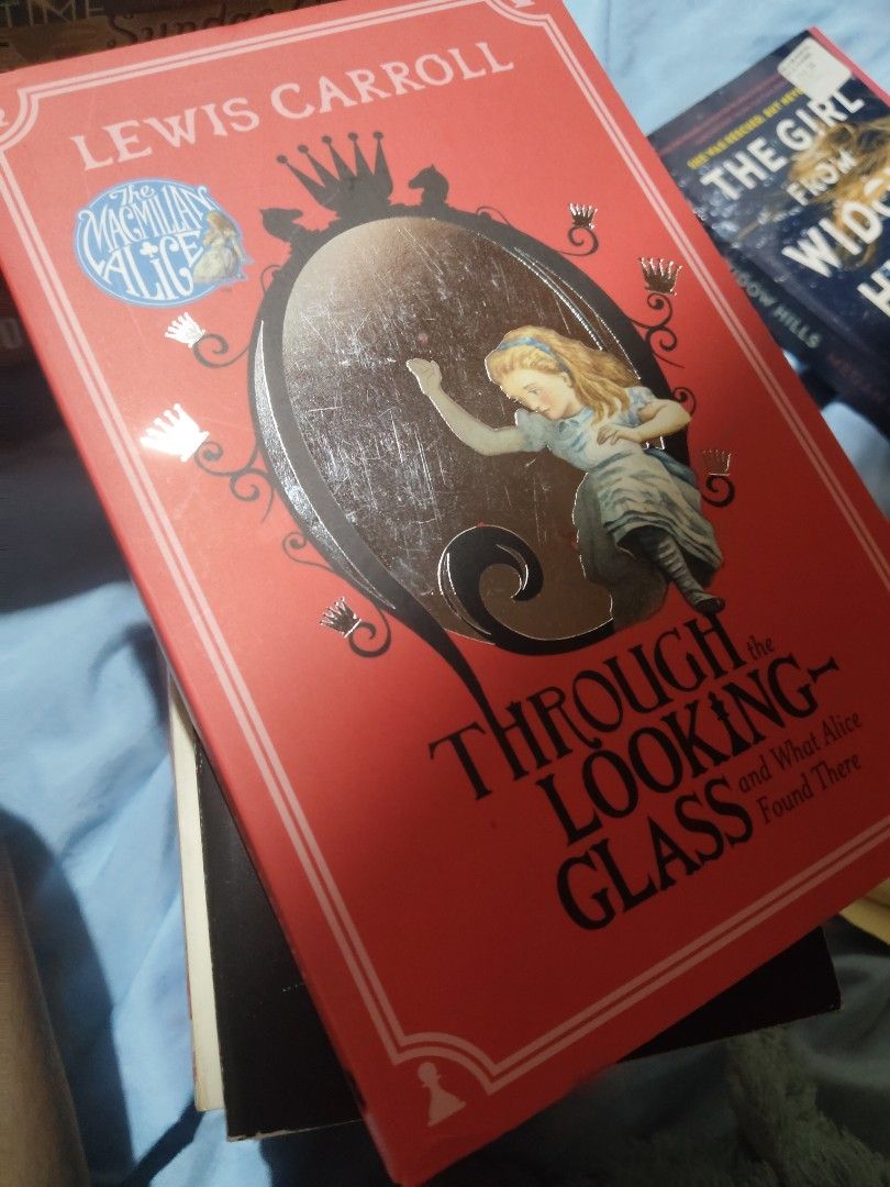 Through the Looking Glass (Category: Storybooks) located in Manila. Submitted by sorbwtty (Listing ID 1441271172, Image 1). Description: Bought this for 100 pesos from another Carousell seller. RFS: overlooked that my copy of alice in the wonderland is unabridged with "through the looking glass". This one has more illustrations though. Mint condition, no foxing yet but the pages are starting to yellow-brown..