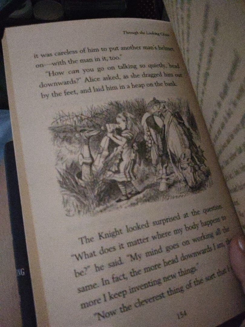 Through the Looking Glass (Category: Storybooks) located in Manila. Submitted by sorbwtty (Listing ID 1441271172, Image 2). Description: Bought this for 100 pesos from another Carousell seller. RFS: overlooked that my copy of alice in the wonderland is unabridged with "through the looking glass". This one has more illustrations though. Mint condition, no foxing yet but the pages are starting to yellow-brown..