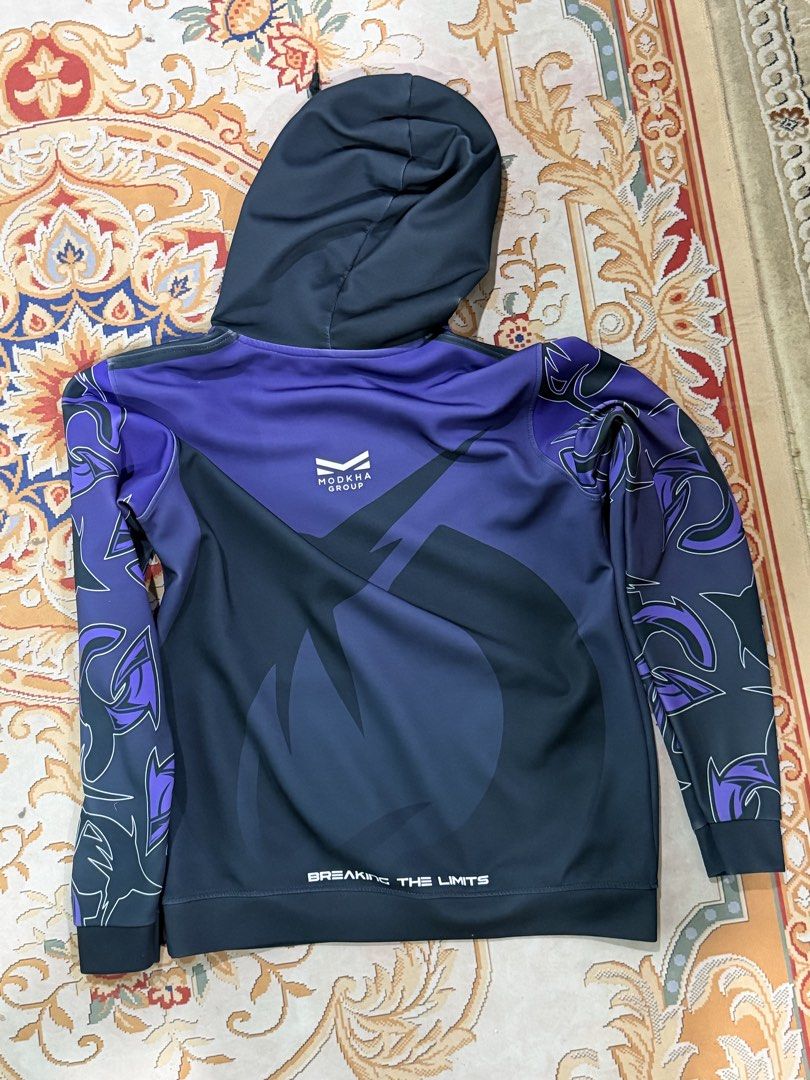 TODAK Esports Purple Hoodie | Official Merch (Category: Coats, Jackets and Outerwear) located in Johor Bahru. Submitted by farid229 (Listing ID 1441377223, Image 2). Description: Official TODAK esports hoodie featuring a premium purple gradient design with TODAK and Modkha Group branding. Comfortable polyester material with front kangaroo pocket and adjustable hood. Perfect for esports fans, casual wear, or collectors of Malaysian gaming merchand
