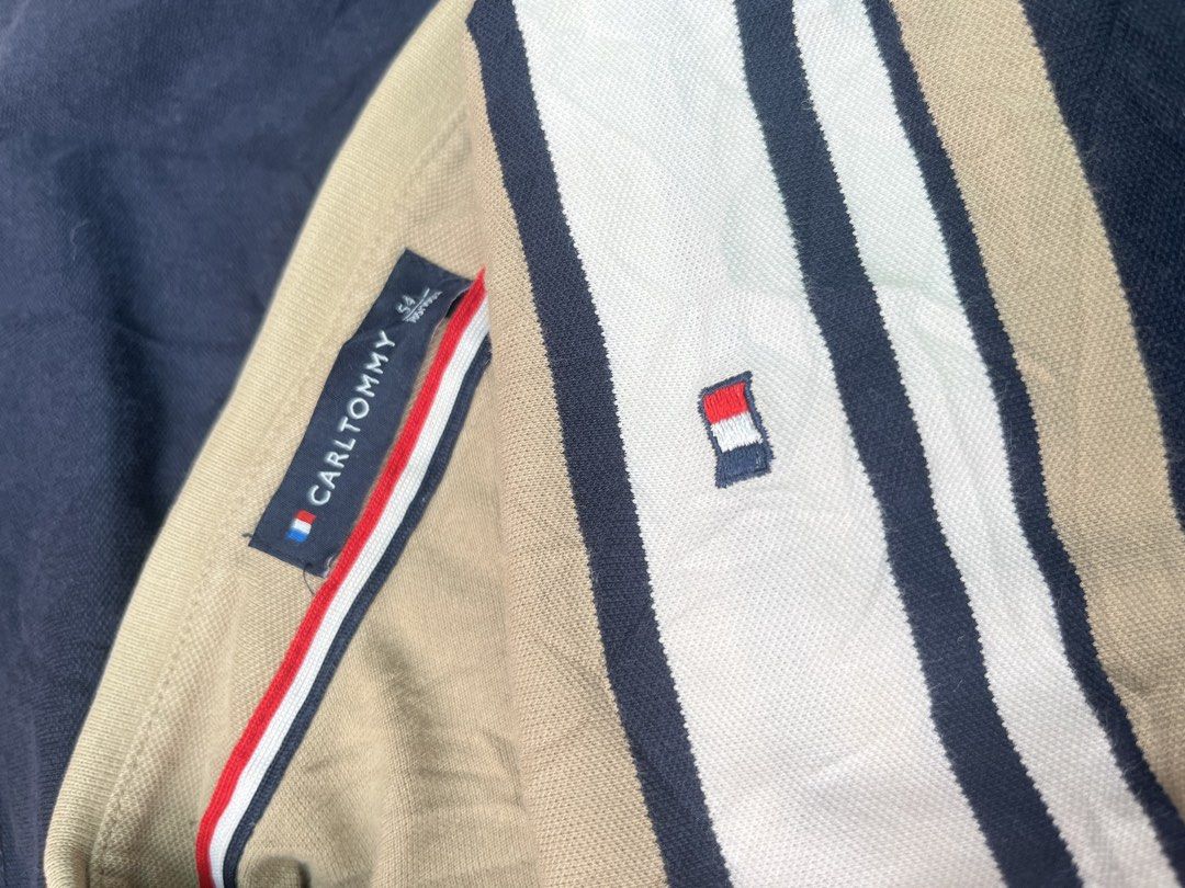 Striped Polo Shirt (Category: Tshirts & Polo Shirts ) located in Taguig. Submitted by s.showi (Listing ID 1441287361, Image 2). Description: - Classic tan, white, and navy stripe design across the chest - Short sleeves with a comfortable ribbed collar - Button-up neckline for adjustable comfort - Measurements: Length 63cm, Width 52cm - Ideal for everyday casual wear.