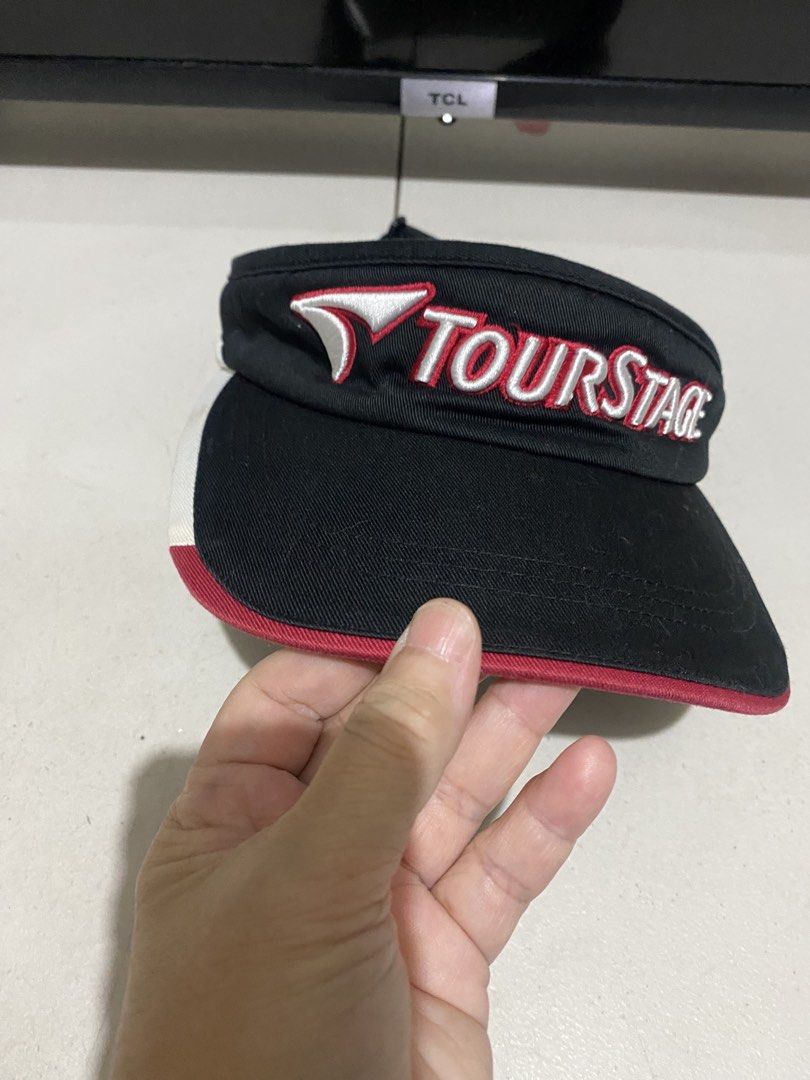 Tourstage Golf Visor Black Red White Adjustable (Category: Golf) located in Manila. Submitted by resi.diaz (Listing ID 1441340384, Image 2). Description: - with stain shown in photo. - Tourstage golf visor - Color: Black with red and white accents - Adjustable strap for a comfortable fit - Ideal for sunny days on the golf course - Helps keep sun out of your eyes - Suitable for golf and other outdoor activities.