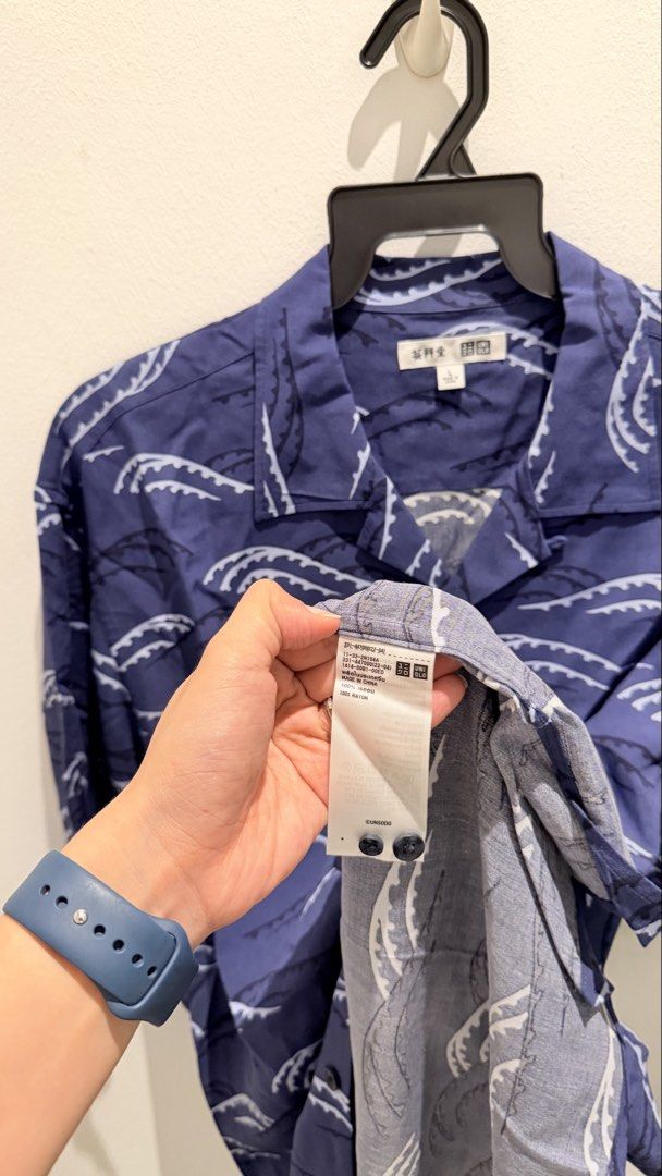 Uniqlo Short Sleeve Shirt - Blue Wave Pattern (Category: Tshirts & Polo Shirts) located in Singapore. Submitted by letsdeclutt (Listing ID 1441295252, Image 2). Description: - Uniqlo Short Sleeve Button-Up Shirt - Cool Blue Wave Pattern - 100% Rayon Fabric - Relaxed Fit - Size L - Perfect for Casual Wear.