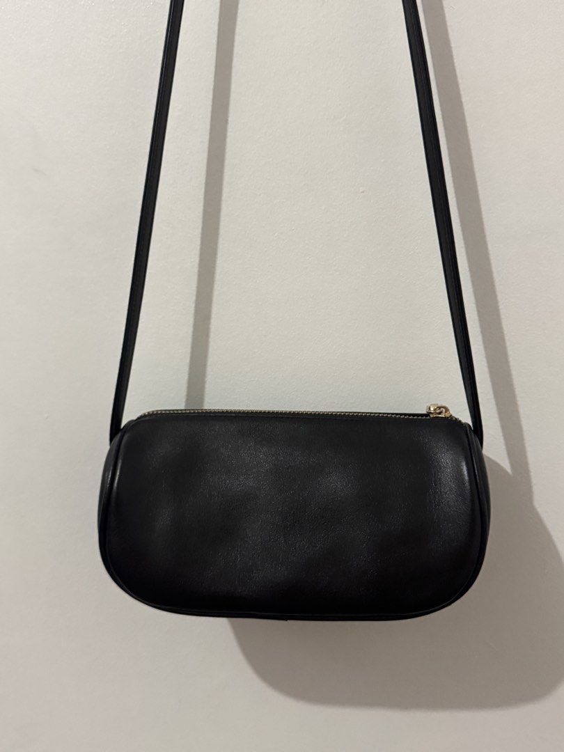Unsimple Omega Bag - Black (Category: Shoulder Bags) located in Quezon City. Submitted by afpar (Listing ID 1441232474, Image 2). Description: Purchased from Taiwan Looks good as new Genuine nappa textured cowhide leather.