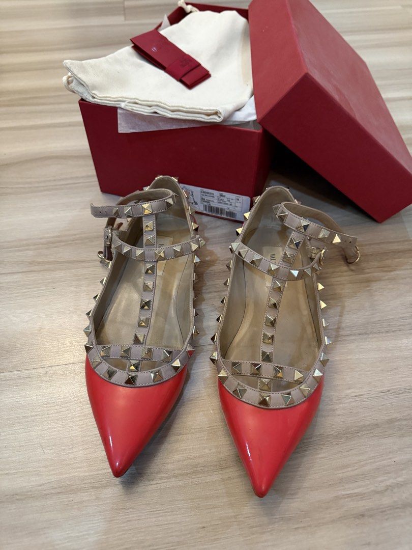 Valentino Rockstud pink Patent Leather Flats (Category: Flats & Sandals) located in Mandaluyong City. Submitted by kar510 (Listing ID 1441210795, Image 2). Description: - Valentino Rockstud flats - Red patent leather - Signature pyramid stud detailing - T-strap design - Includes original box, dust bag, and authenticity cards - Classic designer piece.