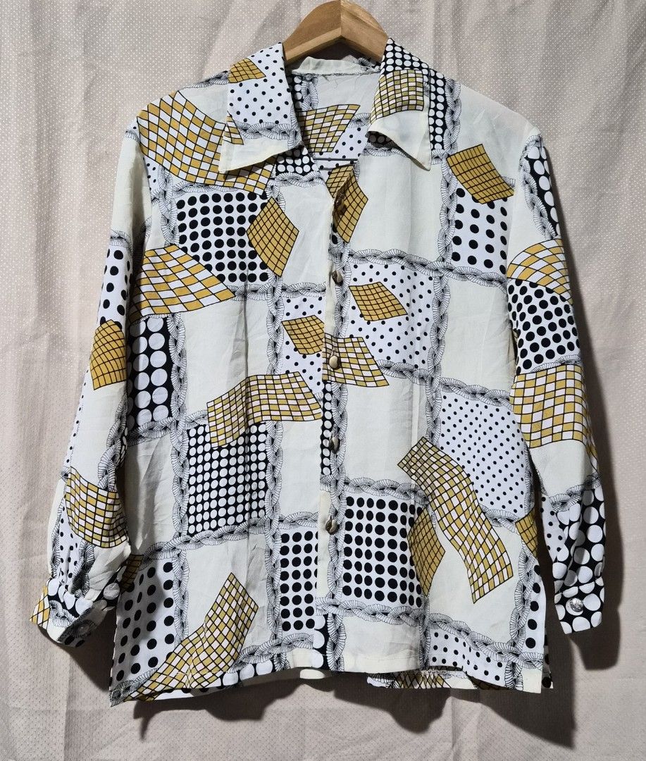 Vintage Geometric Print Button-Up Shirt (Category: Tshirts & Polo Shirts ) located in Mandaue City. Submitted by chuchi152615 (Listing ID 1441323931, Image 1). Description: - Unique retro button-up shirt - Eye-catching geometric and polka dot pattern - Cream base with black, white, and yellow accents - Long sleeves with button cuffs - Classic collar - Perfect for a statement outfit - Approximate measurements: 19 inches pit to pit.