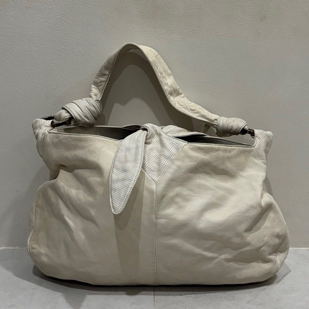 Vintage loewe top handle bag (Category: Luxury Bags & Wallets) located in Cebu City. Submitted by florianmiral (Listing ID 1441277861, Image 1). Description: Vintage loewe top handle bag Very good condition due to its age Sign of usage but still presentable and wearable .