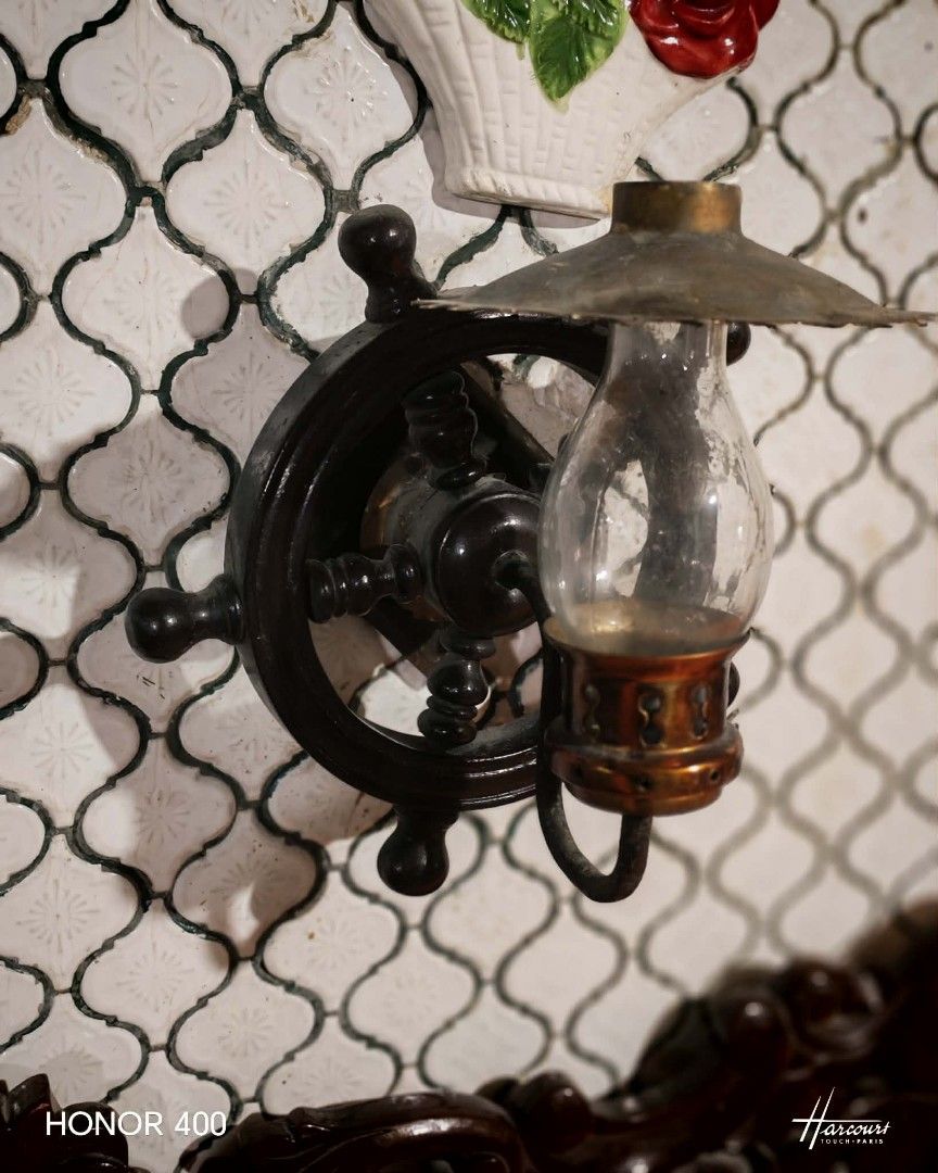 Vintage Nautical Ship Wheel Wall Sconce Lamp (Category: Lighting) located in Manila. Submitted by peeweemend69204 (Listing ID 1441232059, Image 2). Description: - Unique ship wheel design wall sconce - Features a clear glass hurricane shade - Rustic metal finish for a vintage/nautical look - Adds charm to hallways, living rooms, or themed spaces - Easy wall mounting - A great conversation starter.