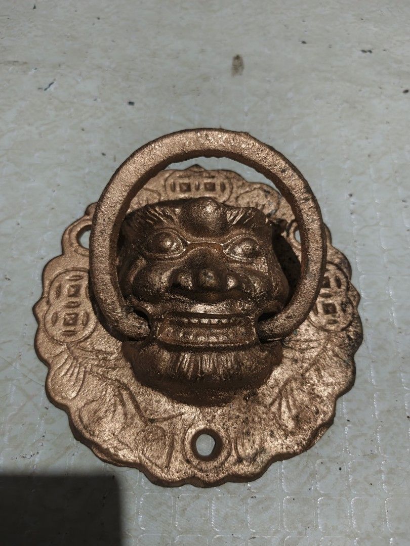 Vintage Style Lion Head Door Knocker (Category: Other Home Decor) located in Manila. Submitted by erica111591 (Listing ID 1441300158, Image 2). Description: - Heavy duty door knocker - Fierce lion head design with ring - Made of metal (likely brass or bronze finish) - Adds unique character to any door - Easy to mount with screws - Perfect decorative piece.