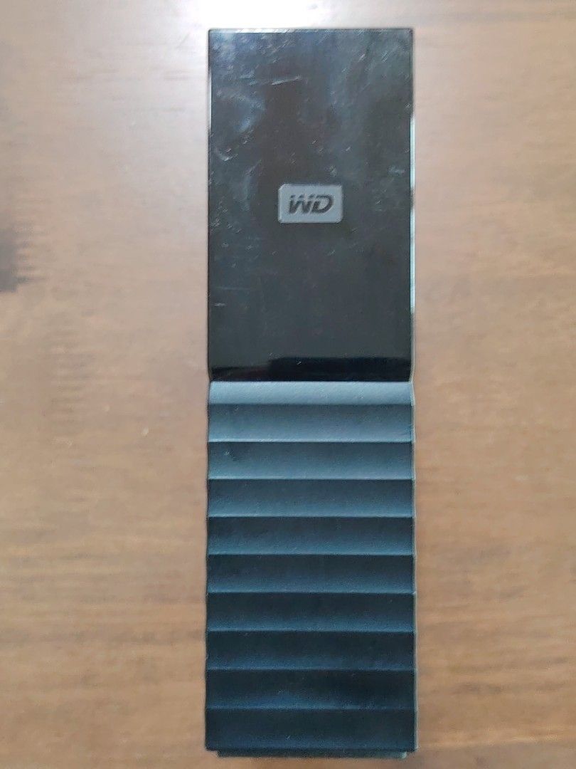 Western Digital WD My Book External Hard disk HDD 4TB (Category: Hard Disks & Thumbdrives) located in Singapore. Submitted by eternal-fire (Listing ID 1441235010, Image 2). Description: - Western Digital My Book External Hard Drive - Storage Capacity: 4TB - Color: Black - Sleek, modern design - Includes power adapter and USB cable - Ideal for backups and extra storage.