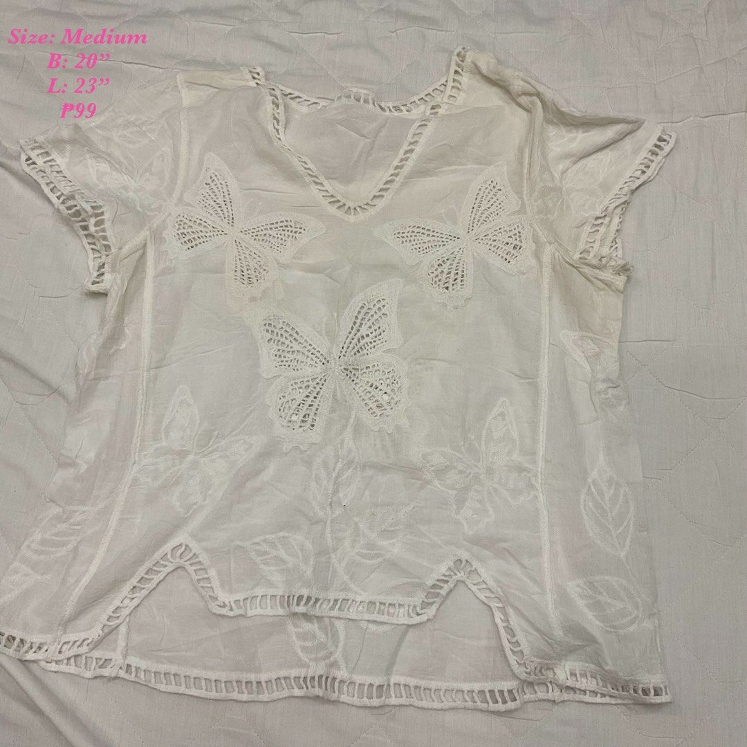 White Butterfly Embroidered V-Neck Top (Category: Sleeveless) located in Las Pinas. Submitted by jhoyiii (Listing ID 1441237748, Image 1). Description: - White short-sleeved top - Size: Medium - V-neck design - Intricate butterfly embroidery - Crochet-like hem detail - Lightweight and airy fabric - Ideal for casual outings or as a beach cover-up.