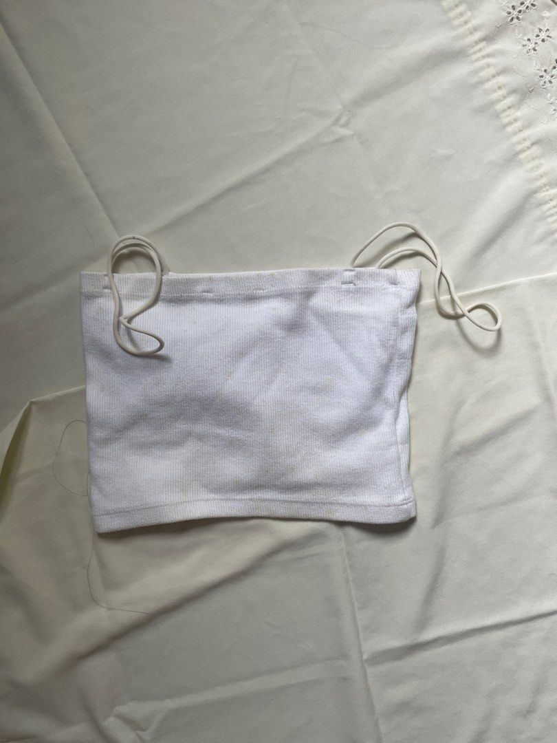 White Ribbed Tube Top with Straps (Category: Sleeveless) located in Quezon City. Submitted by declutter._.closet (Listing ID 1441226541, Image 1). Description: - White ribbed tube top - Thin, adjustable straps - Stretchy material for a comfortable fit - Perfect for layering or wearing on its own - A simple and versatile wardrobe essential.