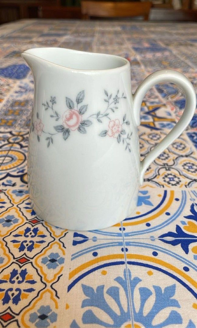 White teacup and saucer with pink roses pattern (Category: Dinnerware & Cutlery) located in Quezon City. Submitted by momof3since2016 (Listing ID 1441204356, Image 3). Description: - Delicate bone china (Noritake) dining set. - Features a charming pink rose and grey leaf design. - Perfect for hosting guests and In laws - Adds a lovely touch to your kitchen or dining area. - Makes a wonderful gift idea..