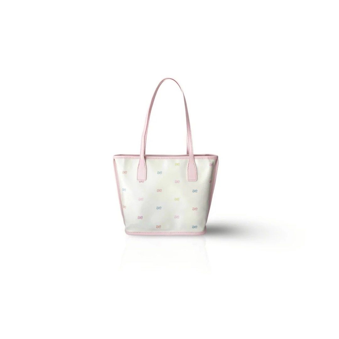 White Tote Bag with Pink Trim and Bow Pattern (Category: Shoulder Bags) located in Caloocan City. Submitted by kyliecolee.whale (Listing ID 1441372699, Image 1). Description: - Adorable white tote bag - Features a charming pastel bow pattern all over - Accented with pink trim and handles - Ideal for everyday errands or weekend getaways - Offers ample space for your essentials - Clean and minimalist design.