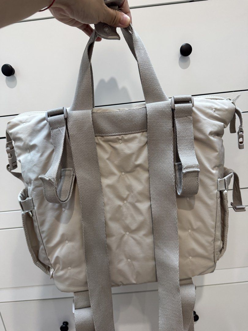 Zara Quilted Diaper Bag Backpack with Changing Mat (Category: Backpacks) located in Mabalacat. Submitted by jastin17 (Listing ID 1441265020, Image 2). Description: - Zara quilted diaper bag backpack - Neutral beige color with subtle heart pattern - Multiple interior pockets for easy organization - Includes a matching changing mat (not used) - Adjustable straps for stroller.