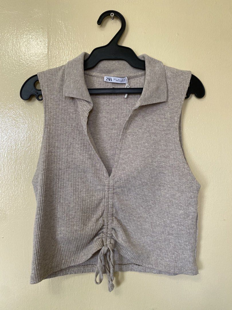 Zara Ribbed Collared Sleeveless Ruched Crop Top (Category: Sleeveless) located in Makati City. Submitted by disneygurl_w12318 (Listing ID 1441341272, Image 1). Description: - Zara sleeveless crop top - Ribbed knit fabric - Collared neckline with V-cut - Adjustable front drawstring for cinched waist.