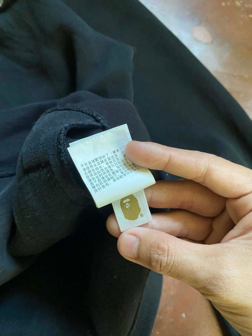 A Bathing Ape BAPE Full Zip Hoodie Size S (Category: Coats, Jackets and Outerwear) located in Montevista. Submitted by aguderaiva84994 (Listing ID 1443011777, Image 3). Description: - Brand: A Bathing Ape (BAPE) - Color: Black - Style: Full Zip Hoodie - Features: Iconic BAPE logo patch on sleeve and chest, BAPE logo zipper pull - Size: Tagged S - Ideal for: Casual wear.