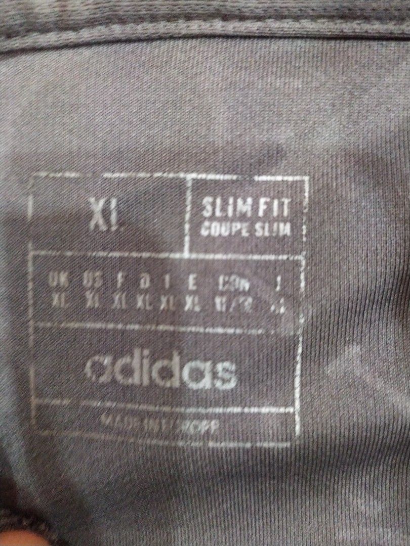 Adidas Real Madrid 2022/23 Away Jersey XL (Category: Activewear) located in Singapore. Submitted by special_sarees4 (Listing ID 1443029536, Image 3). Description: - Grey Adidas Real Madrid away jersey - Emirates Fly Better sponsor - Size: XL - Fit: Slim fit - Features: Adidas logo and Real Madrid crest - Design: Subtle all-over pattern - Ideal for: Real Madrid fans.