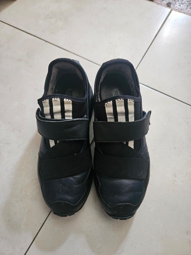 Adidas Y-3 Yohji Yamamoto Black Strap Sneakers (Category: Sneakers) located in Singapore. Submitted by lilo0705 (Listing ID 1442993708, Image 2). Description: Y-3 Adidas Yohji Yamamoto Sneakers – EU 38 / US 6.5 – $20 Selling a pair of authentic Y-3 Adidas Yohji Yamamoto sneakers. Details: - Size: EU 38 / US 6.5 / UK 5 - Colour: Black - Pre-owned condition - Y-3 branding intact - Outsoles still have good tread remaining - Normal signs of wear from
