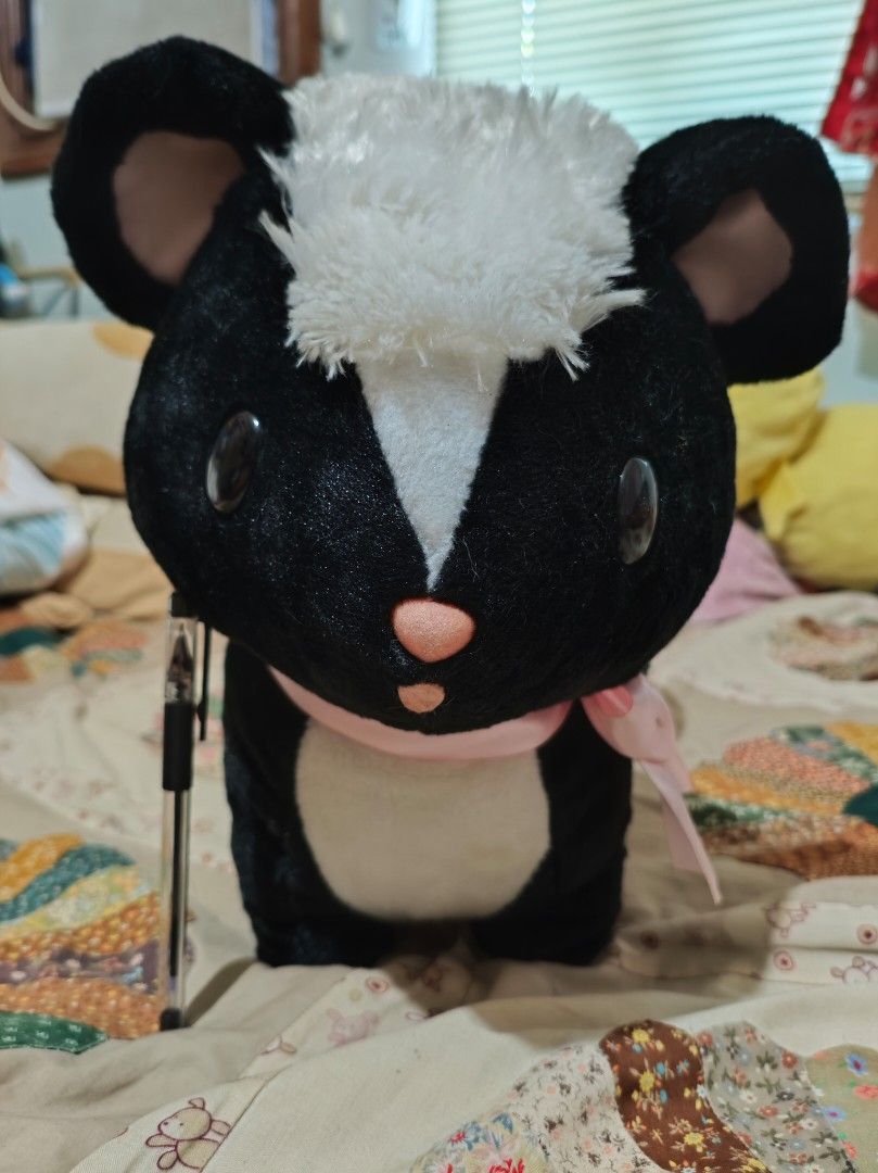 Amuse Skunk Big Plushie, Stuffed Plush Toy (Category: Plushies & Soft Toys) located in Lapu Lapu. Submitted by plurffle (Listing ID 1429299241, Image 2). Description: PLEASE READ DESCRIPTION AND DELIVERY DETAILS BEFORE MAKING OFFER "Sugar-Sugar Skunk" 🦨🍭 PiPi Been only kept as decoration. What you see is what you get, may need spot cleaning. Very cute and huggable! Brand/Etiketa: Amuse, Amufun Flaws: Small marks on bow (pwede remove ang bow if 
