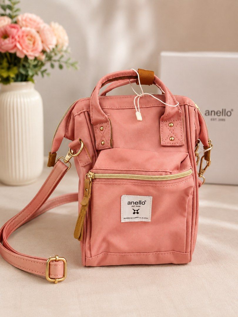 Anello 2-Way Micro Shoulder Cross Bottle (Category: Backpacks) located in Quezon City. Submitted by kategabriel_14 (Listing ID 1442984792, Image 1). Description: - Cute Anello bag in lovely rose pink - Versatile: can be worn as a backpack or crossbody - Made of durable canvas material - Features a front zipper pocket and spacious main compartment - Elegant gold hardware details - Comes with original tags attached - price is negotiable .