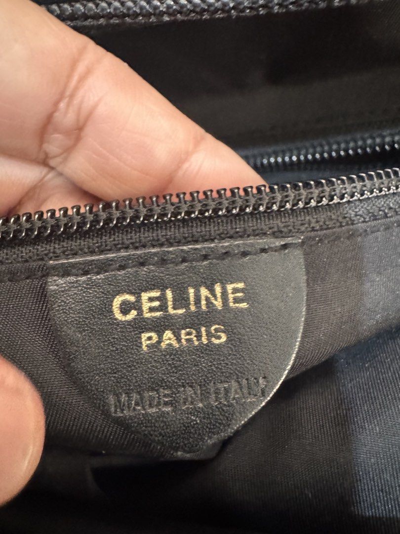 Authentic Celine Paris Black Nylon Tote Bag (Category: Luxury Bags & Wallets) located in San Pablo. Submitted by docannie3869170 (Listing ID 1443125193, Image 3). Description: - Celine Paris black nylon tote bag - Gold tone hardware - Circular logo charm - Made in Italy - Zipper closure - Classic piece for everyday use.