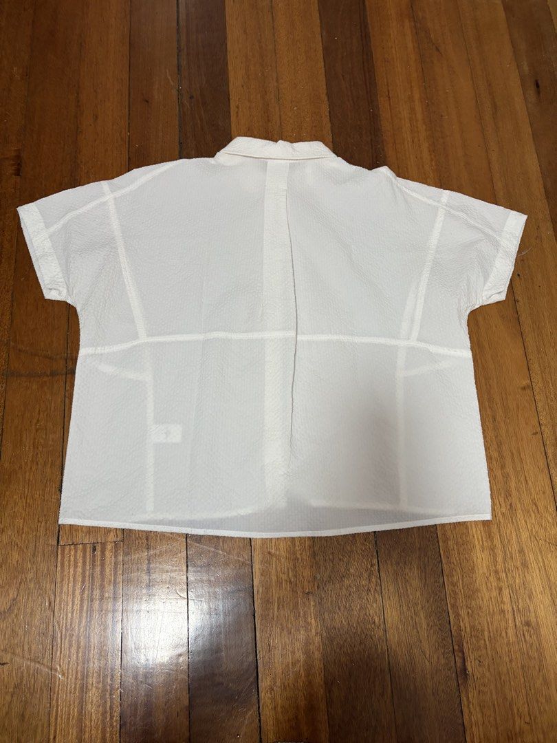 Authentic Mosaic White Textured Button Down Top (Category: Blouses) located in Quezon City. Submitted by mnl.declutter (Listing ID 1443024458, Image 2). Description: Authentic Mosaic White Textured Button Down Top •in great condition •fits S-XL Size guide •width ≈ 23 in •length ≈ 22 in •sleeve length ≈ 13 in DM for any questions or inquiries! 😊 MOP - Gcash SF - c/o buyer .