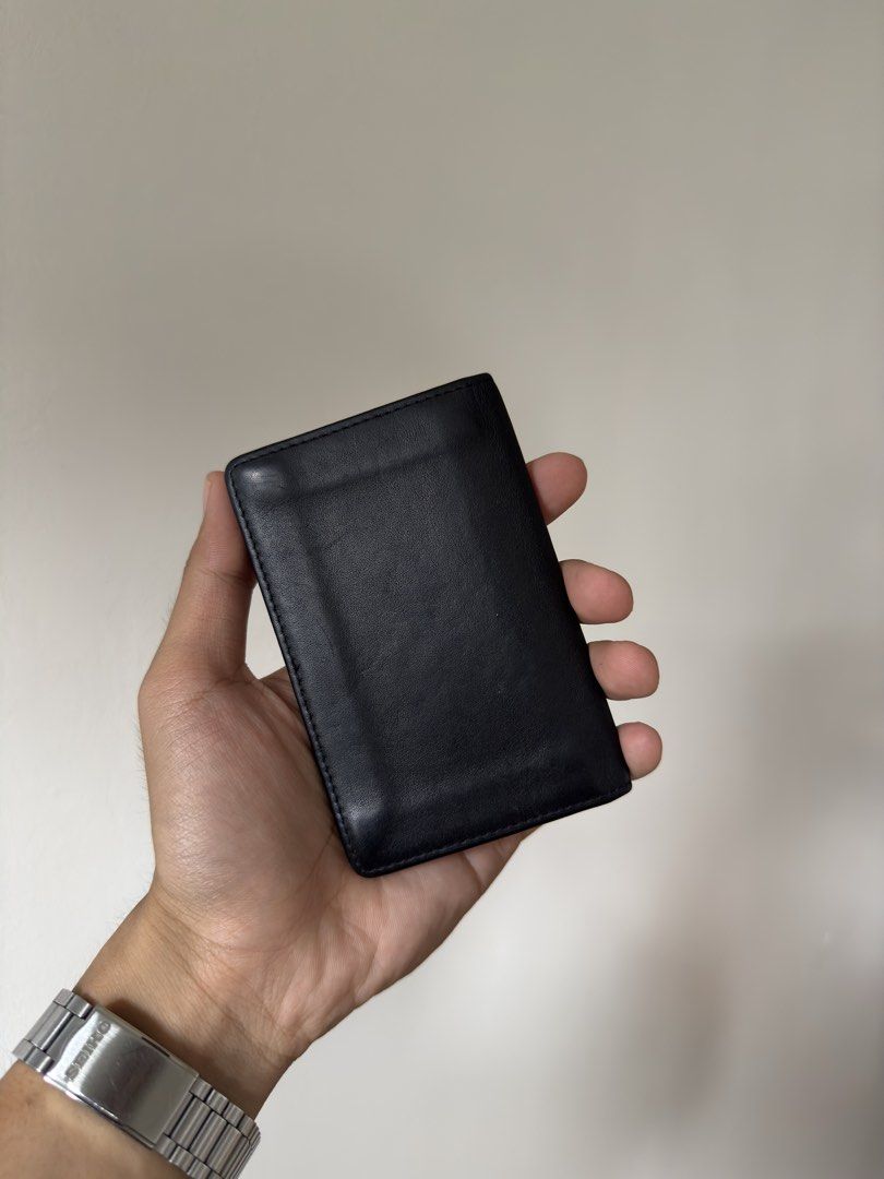 Balenciaga Black Leather Card Holder (Category: Luxury Bags & Wallets) located in Manila. Submitted by yourboy.ad (Listing ID 1442973779, Image 3). Description: - Authentic Balenciaga card holder - Color: Black leather - Embossed Balenciaga logo inside - Multiple card slots for organization - Slim and pocket-friendly design - Minimalist and stylish.