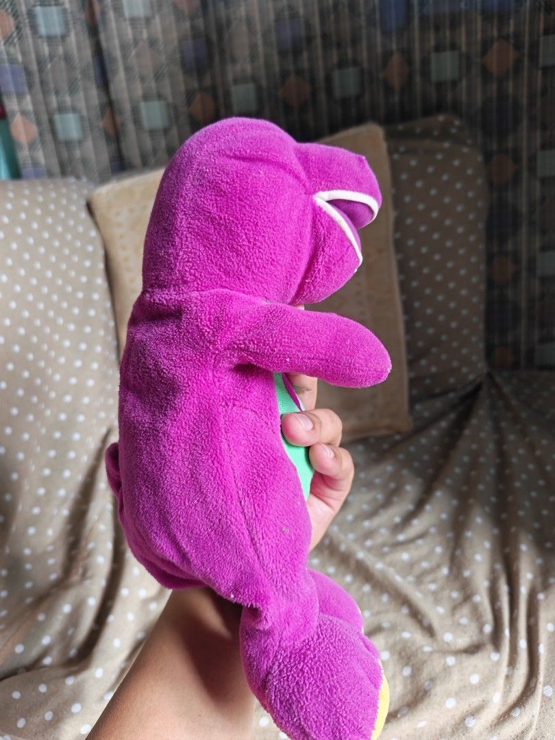 Barney the Dinosaur Plush Toy (Category: Plushies & Soft Toys) located in Carmona. Submitted by tech_hub_cavite (Listing ID 1442971672, Image 3). Description: - Adorable purple Barney plush toy - Features a green vest with a cute pink heart - Incredibly soft and cuddly material - A must-have for all Barney enthusiasts - Ready to bring joy to a new home.