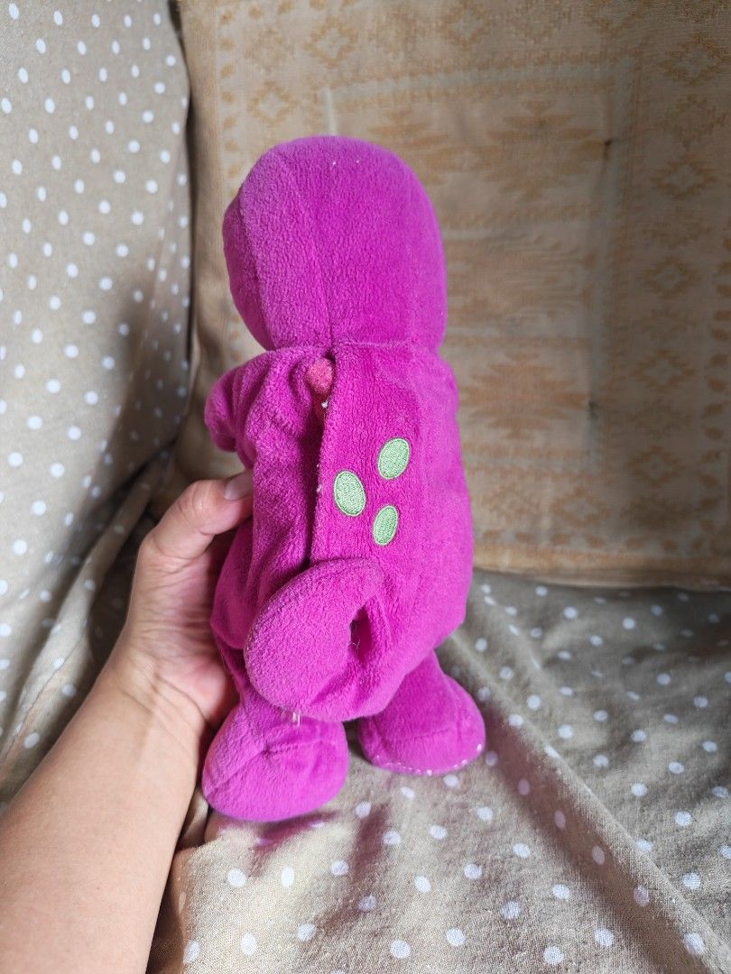 Barney the Dinosaur Plush Toy (Category: Plushies & Soft Toys) located in Carmona. Submitted by tech_hub_cavite (Listing ID 1442971672, Image 2). Description: - Adorable purple Barney plush toy - Features a green vest with a cute pink heart - Incredibly soft and cuddly material - A must-have for all Barney enthusiasts - Ready to bring joy to a new home.