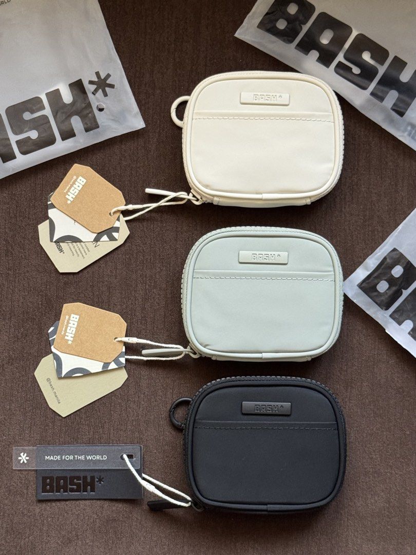 BASH* Essential Cardholder (Category: Purses & Pouches) located in Manila. Submitted by marco.21 (Listing ID 1442979574, Image 1). Description: - Brand: BASH* - Available Colors: Bone, Slate, Sage - Closure: Zippered - Features: Small front pocket - Includes: Original tags and dust bags - Ideal for: Organizing small essentials.