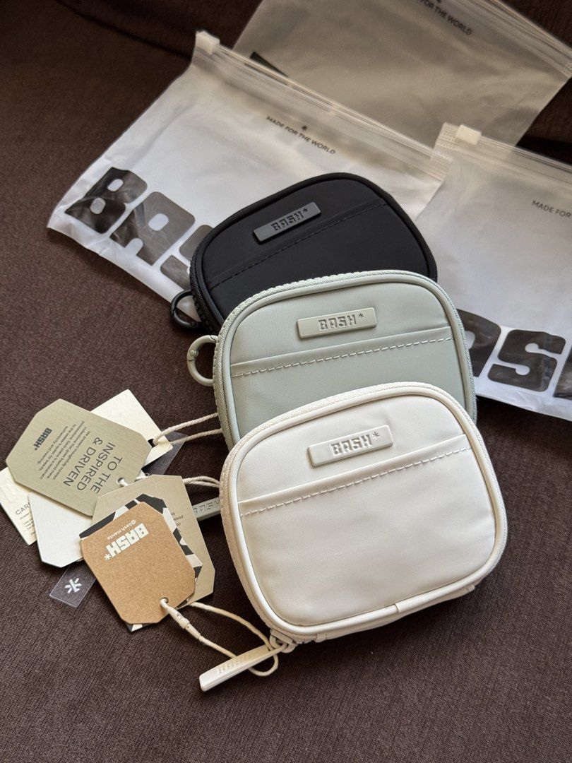 BASH* Essential Cardholder (Category: Purses & Pouches) located in Manila. Submitted by marco.21 (Listing ID 1442979574, Image 2). Description: - Brand: BASH* - Available Colors: Bone, Slate, Sage - Closure: Zippered - Features: Small front pocket - Includes: Original tags and dust bags - Ideal for: Organizing small essentials.