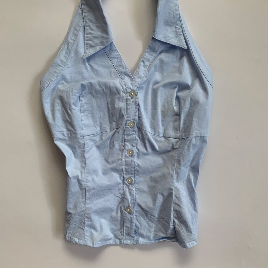 BCBG Max Azria Light Blue Halter Button-Up Shirt Size 8 (Category: Blouses) located in Tarlac. Submitted by luv__vintage (Listing ID 1443053218, Image 3). Description: - Brand: BCBG Max Azria - Color: Light Blue - Style: Halter Top - Neckline: Collared - Closure: Button-up front - Fit: Fitted - Size: 8 - Occasion: Great for a night out or a casual day..