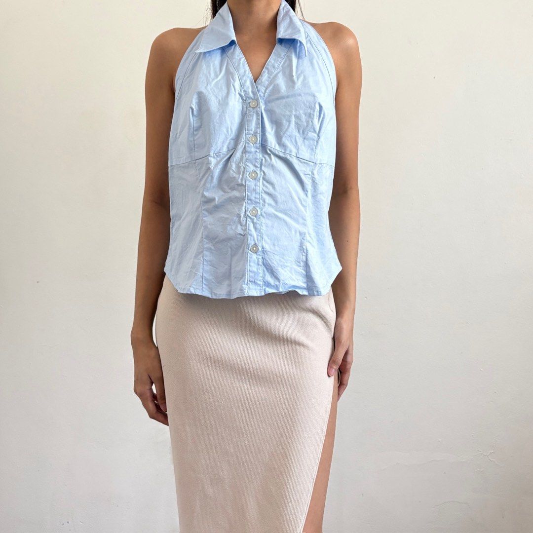 BCBG Max Azria Light Blue Halter Button-Up Shirt Size 8 (Category: Blouses) located in Tarlac. Submitted by luv__vintage (Listing ID 1443053218, Image 1). Description: - Brand: BCBG Max Azria - Color: Light Blue - Style: Halter Top - Neckline: Collared - Closure: Button-up front - Fit: Fitted - Size: 8 - Occasion: Great for a night out or a casual day..