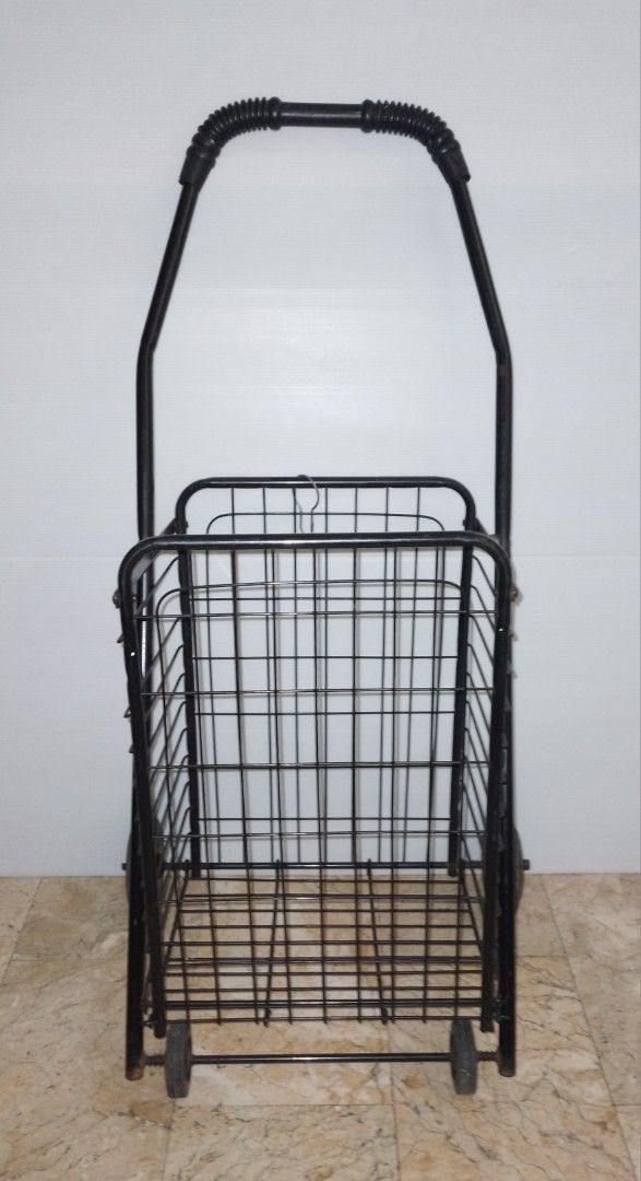 Black Folding Shopping Cart Trolley (Category: Everything Else Others) located in Pasig City. Submitted by eclectic_stuff (Listing ID 1442996054, Image 1). Description: - Sturdy black metal shopping cart - Folds flat for easy storage - Smooth-rolling wheels and sturdy handle (4-wheeled) - Perfect for groceries, laundry, and more - Minor cosmetic scuffs from normal use, but fully functional ■Height> 33" tall Flaw- 1-metal strip on 1-side removed..