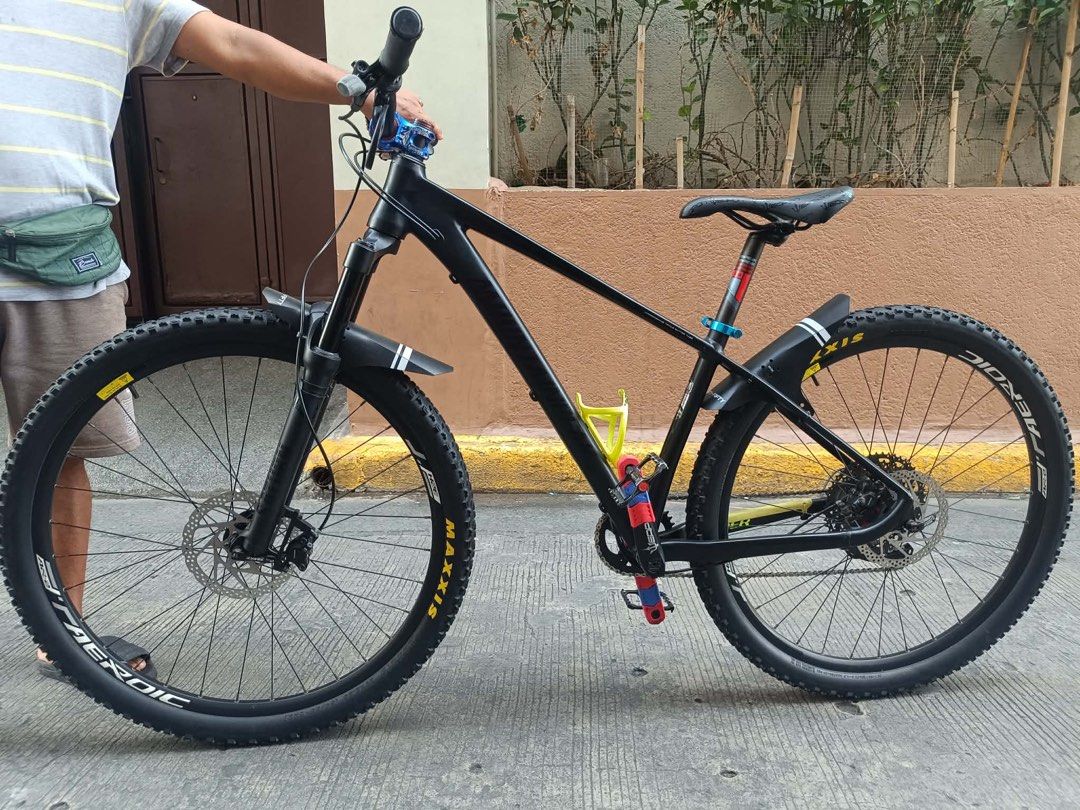 Black Mountain Bike with Maxxis Tires (Category: Bicycles) located in Manila. Submitted by queennhei (Listing ID 1443047310, Image 1). Description: 🚲 Bike Specifications * Wheel Size: 29er * Fork: Saturn Air Shock (29er) * Seatpost: Mountainpeak, 31.6mm * Pedals: Mountainpeak * Crankset: Weapon, 36T * Rear Derailleur (RD): Shimano Deore M520, 10-Speed, with Clutch * Shifter: Shimano Deore 10-Speed * Cassette/Cogs: Sagmit, 11-50T * Hub: Tanke, 6 