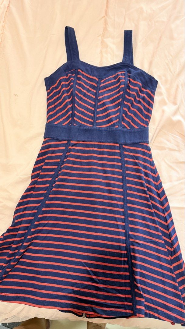 Blueo Striped Dress Size S (Category: Dresses) located in Manila. Submitted by hellokittyjhoe (Listing ID 1442978107, Image 1). Description: - Chic navy blue dress with eye-catching red stripes. - Comfortable stretchy fabric for a great fit. - Convenient zipper closure at the back. - Ideal for everyday casual wear. - Fits a size Small (S)..