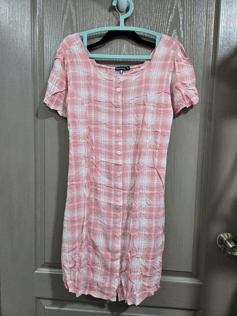 Bossini Pink Plaid Button-Up Shirt Size M (Category: Shirts) located in Rizal. Submitted by marrenkeithly (Listing ID 1443082513, Image 1). Description: - Bossini Pink & White Plaid Shirt - Size: Medium (M) - Short sleeves - Button-up front - Side gathering detail - Perfect for casual wear.
