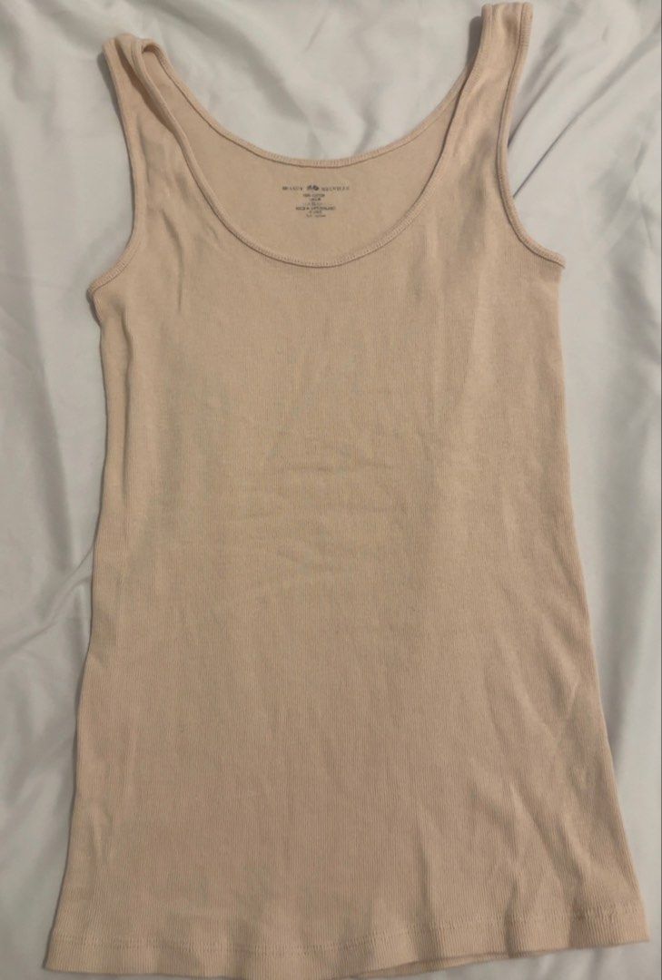 Brandy Melville Light Pink Tank Top (Category: Sleeveless) located in Mandaluyong City. Submitted by wp1212 (Listing ID 1443106087, Image 1). Description: - Classic Light Pink Tank Top - Brand: Brandy Melville - Material: 100% Cotton - Fit: One size fits most - So comfortable, color suits anything - Used once.