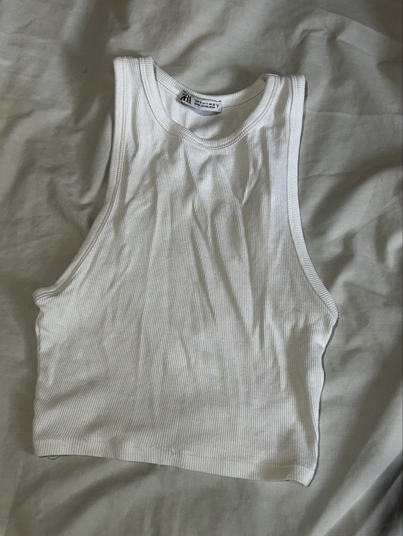 (BUNDLE) ZARA Ribbed Tank Tops - Green & White [S] (Category: Sleeveless) located in Caloocan City. Submitted by ctrl12 (Listing ID 1443014144, Image 2). Description: - Two Zara ribbed tank tops, both Size S. - Color: Bright Green (cropped, square neckline). - Color: White (cropped, racerback). - Versatile basics for your wardrobe. - Ideal for wearing on their own or layering. - Minor flaw: there are a few loose threads at the bottom hem of the w