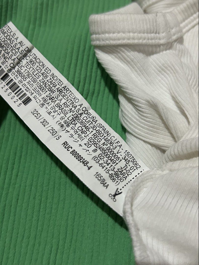 (BUNDLE) ZARA Ribbed Tank Tops - Green & White [S] (Category: Sleeveless) located in Caloocan City. Submitted by ctrl12 (Listing ID 1443014144, Image 3). Description: - Two Zara ribbed tank tops, both Size S. - Color: Bright Green (cropped, square neckline). - Color: White (cropped, racerback). - Versatile basics for your wardrobe. - Ideal for wearing on their own or layering. - Minor flaw: there are a few loose threads at the bottom hem of the w