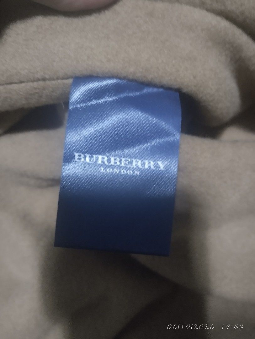 Burberry London trench coat (Category: Luxury Apparel) located in Bacoor. Submitted by nigel_008 (Listing ID 1443035738, Image 3). Description: Vintage Burberry London trench coat good condition.