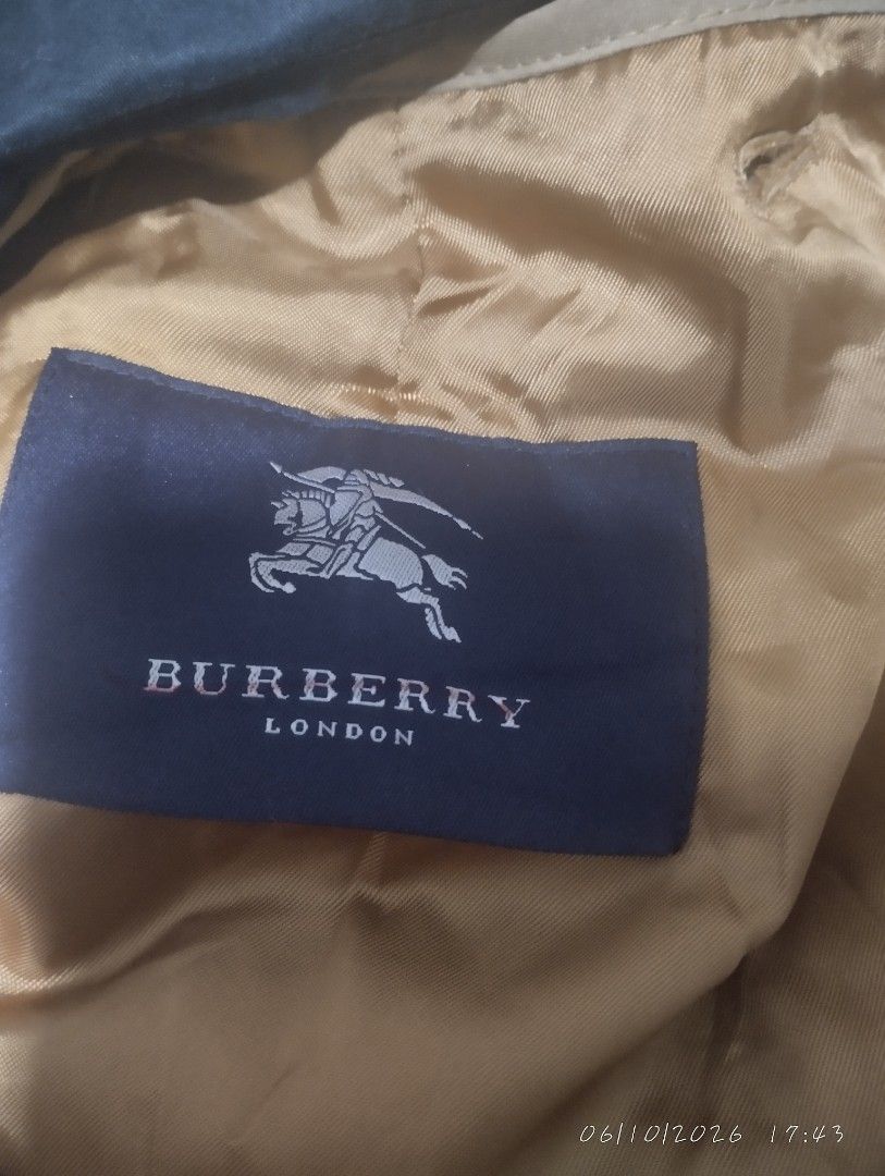 Burberry London trench coat (Category: Luxury Apparel) located in Bacoor. Submitted by nigel_008 (Listing ID 1443035738, Image 2). Description: Vintage Burberry London trench coat good condition.