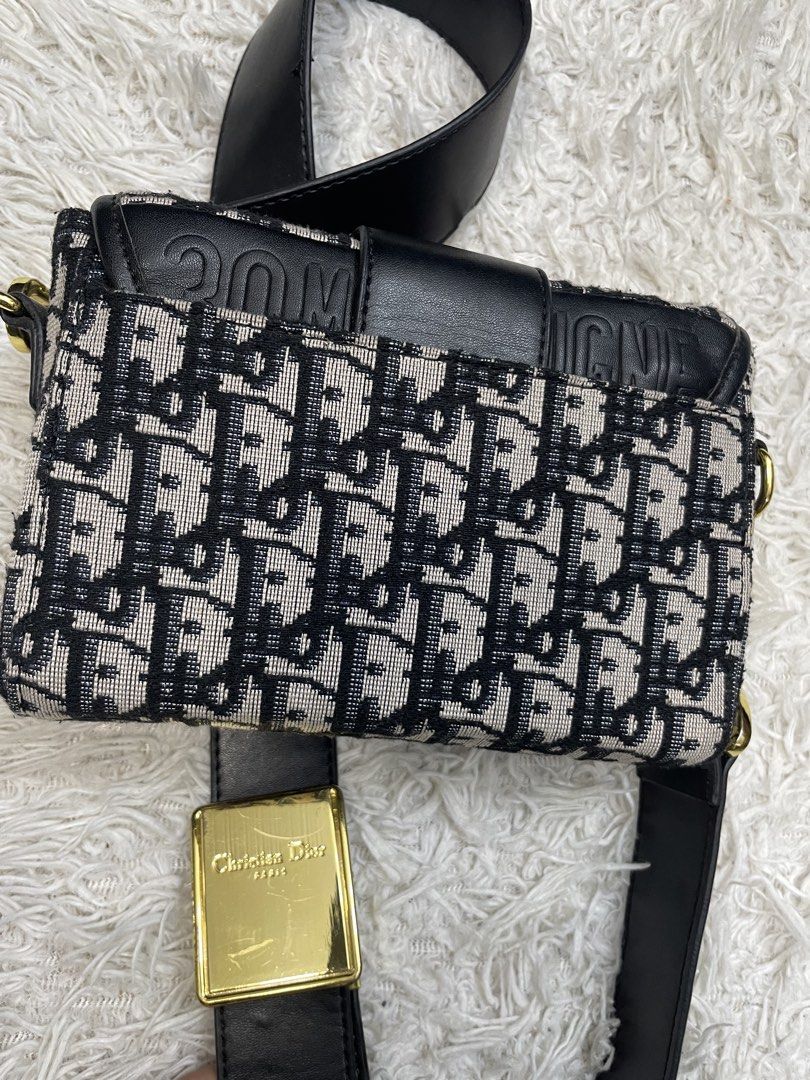 Christian Dior Oblique Saddle Bag (Category: Luxury Bags & Wallets) located in Quezon City. Submitted by impulse.ph (Listing ID 1443111491, Image 3). Description: - Authentic Christian Dior Saddle Bag - Iconic Dior Oblique canvas - Black leather strap and trim - Gold-tone CD buckle closure - Made in Italy - Comes with authenticity tags.