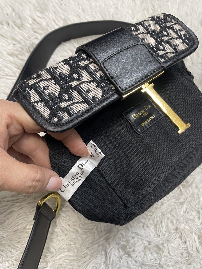 Christian Dior Oblique Saddle Bag (Category: Luxury Bags & Wallets) located in Quezon City. Submitted by impulse.ph (Listing ID 1443111491, Image 2). Description: - Authentic Christian Dior Saddle Bag - Iconic Dior Oblique canvas - Black leather strap and trim - Gold-tone CD buckle closure - Made in Italy - Comes with authenticity tags.